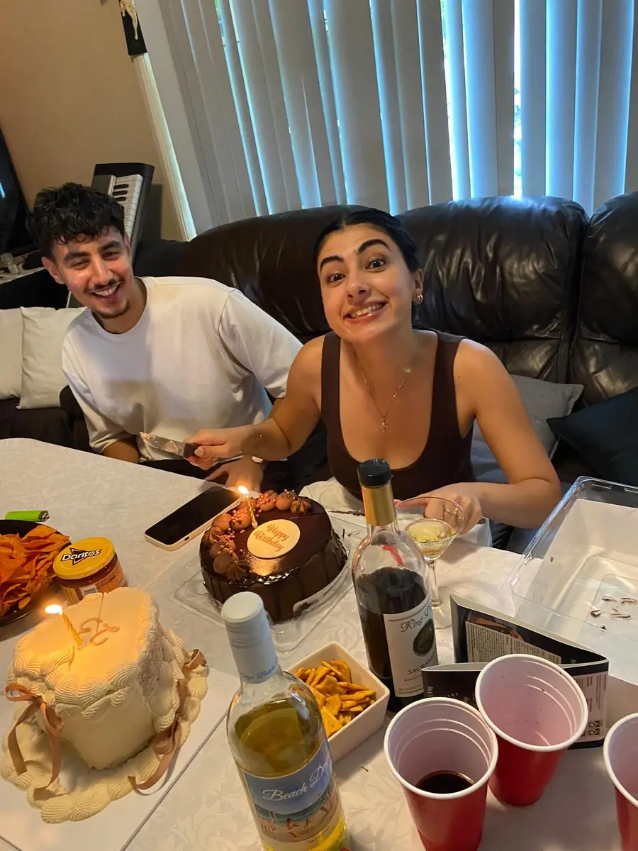 Salwa cutting a birthday cake with Marchi
